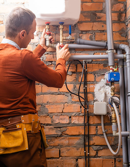 Plumber engineer repairing pipes at work