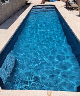 A serene pool filled with clear blue water