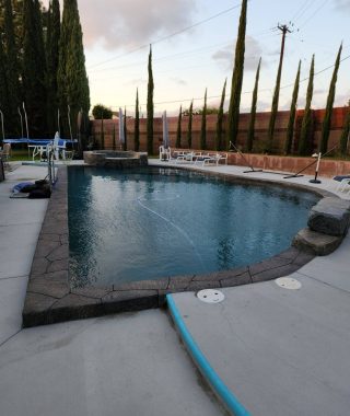 A concrete pool featuring a solid base and sturdy walls