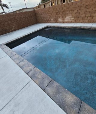 A concrete pool featuring a solid base and sturdy walls