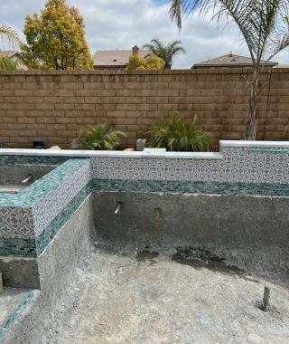 A construction site featuring a pool under construction